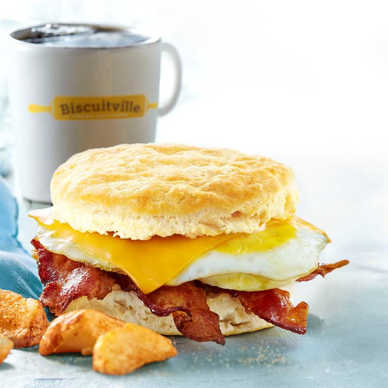 Biscuitville bacon, egg and cheese biscuit combo with potatoes and coffee.